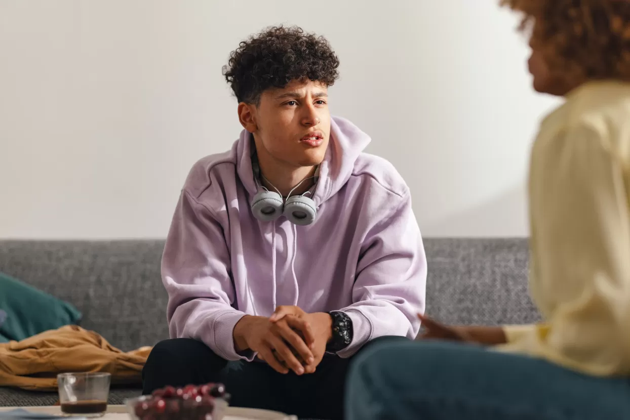 Young man talking to care home manager